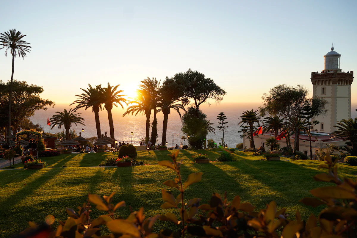 Cape Spartel lighthouse and palm trees at sunset, near Tangier